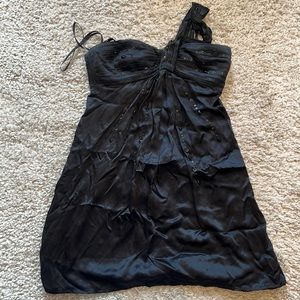 Black swing BCBG dress. I’m a size 2-4 and it fits though a size 8